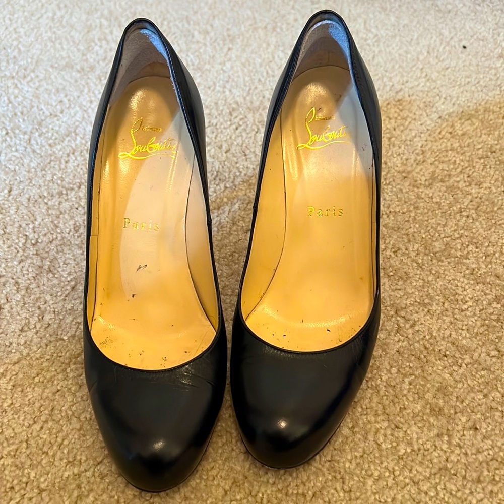 Christian Louboutin black leather pumps